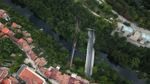 Aerial view of two bridges: one for cars and the other for trains, both starting Stock Footage 250976461