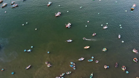 Aerial view of two coracle boats moving in Mui Ne bay Vietnam fisherman Stock-Footage 167715885