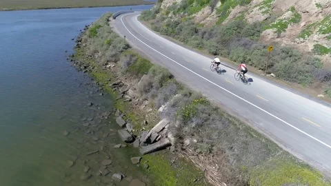 Aerial view of two cyclists riding during exercise routine. Stock Footage 85457925