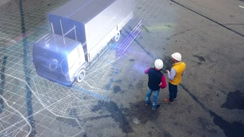 Aerial view of two engineers working with holographic truck, futuristic delivery Stock Footage 153568683