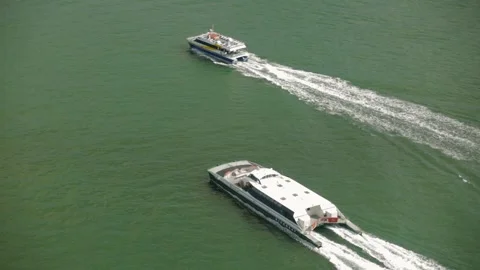 Aerial View of Two Ferries Moving Across Sydney Harbour on a Clear Day Stock Footage 345724320
