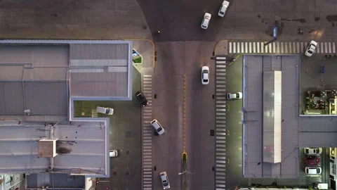 Aerial view of two gas stations with city street in between and cars passin.. Stock Footage 283764486