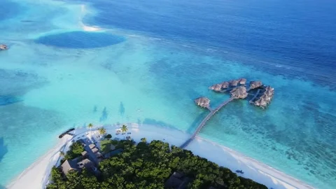 Aerial view of two groups of water bungalows in The Maldives. Luxury resort on Stock Footage 201737081