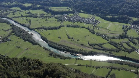Aerial view of two guys flying in tandem paraglide above Soca Valley Stock Footage 120117151