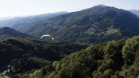 Aerial view of two guys flying in tandem paraglide above Soca Valley Vídeo Stock 120117164