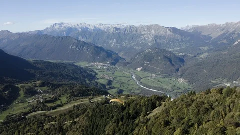 Aerial view of two guys flying in tandem paraglide above Soca Valley Stock Footage 120118670