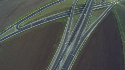 AERIAL view of two intersecting highways. Airplane view of speed motorway, HDR Stock Footage 58383184