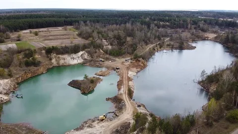 Aerial view of two lakes and dirt road between them quarry Stock Footage 129658334