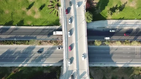 Aerial view of two lane bridge driveway. There is an inner ring road at the bott Stock Footage 136699296