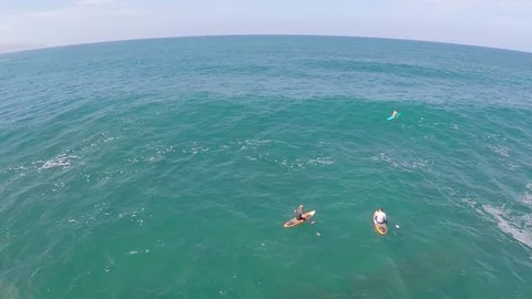 Aerial view of two men sitting on their boards while sup stand-up paddleboard su 스톡 동영상 70482615