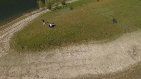 Aerial view. Two musicians Pianist and accordionist playing on the island Stock Footage
