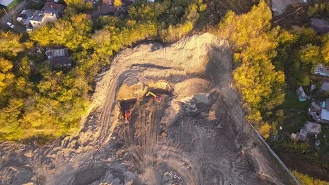 Aerial view of two orange excavators standing at a quarry, one of which extra Stock Footage 96036079