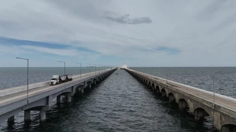 Aerial view of the two parallel lanes of the long bridge that connects Video stock 321452785