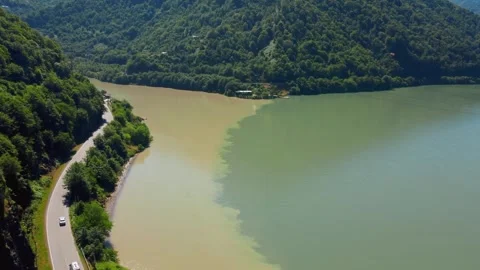 Aerial view of two rivers confluence creating a natural color divide Stock Footage 343315475