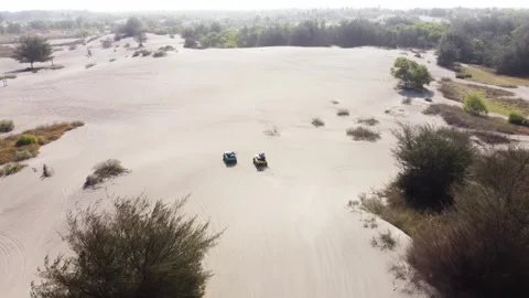 Aerial View of Two Off Road Vehicles Crossing Gumuk Pasir Parangkusumo Sand.. 스톡 동영상 341549669