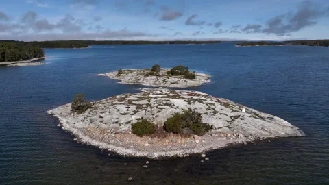 Aerial view of two rocky islets that are typical to the archipelago in Finland Stock Footage 239871693