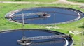 Aerial view of two sedimentation basins with scrapers for sewage cleaning HD Footage