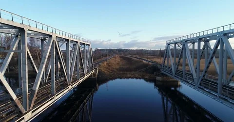 Aerial view of two train bridges in winter landscape in the city near the lake. Stock Footage 84026765