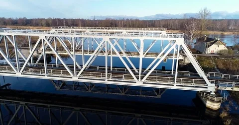 Aerial view of two train bridges in winter landscape in the city near the lake. Stock Footage 84026903