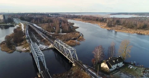 Aerial view of two train bridges in winter landscape in the city near the lake. Stock Footage 84026923