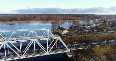 Aerial view of two train bridges in winter landscape in the city near the lake. Stock Footage 84046265