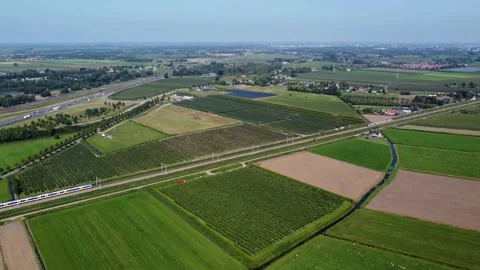 Aerial view of two trains passing eachother on rural railway network 4k Stock Footage 164559870