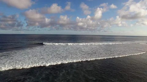 Aerial view of two waves breaking in parallel Stock Footage 61950494