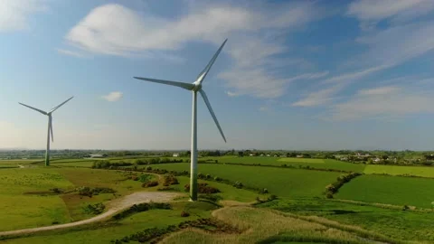 An aerial view of two wind turbines spinning in the countryside. 库存影片 155308971