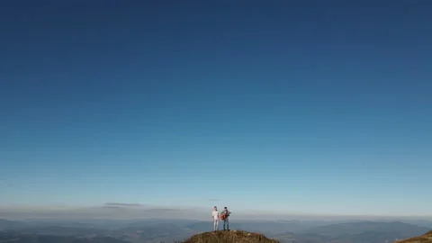 Aerial view of two young guys musician playing acoustic instruments in the Stock Footage 194453511
