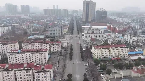 Aerial View of a Typical Small Town in China Residential Blocks and Urban Ro Stock Footage 328290235