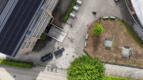 Aerial View of UAV Washing Windows on Modern Building Stockbeeldmateriaal 344735029