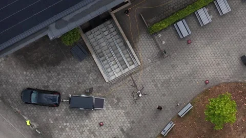Aerial View of UAV Washing Windows on Modern Building Stockbeeldmateriaal 344735061