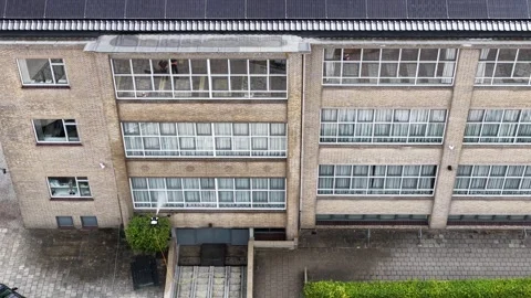 Aerial View of UAV Washing Windows on Modern Building Stockbeeldmateriaal 344735126