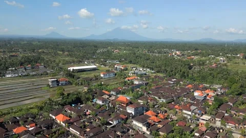 Aerial View Of Ubud Landscape With Active Volcano On The Horizon In Bali Video stock 292857524
