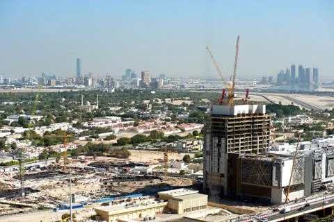 Aerial view of under construction building with cranes from downtown, visible Stock Photos