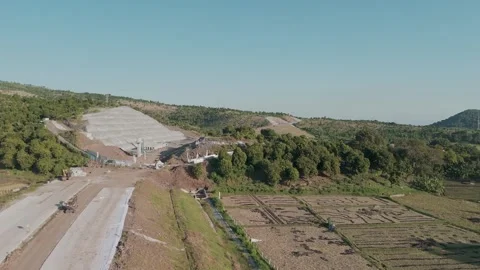 Aerial View of Undergoing Construction Site Surrounded by Lush Greenery and.. Stock Footage 311133469