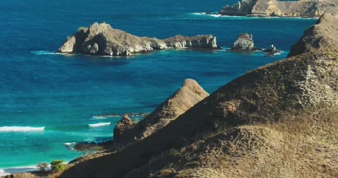Aerial View of Unique Island Shape in Blue Ocean Minimal Composition Video stock 331424118