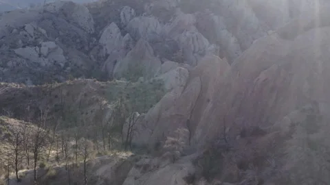 Aerial view of unique rock formations at Devil's Punchbowl with sun flares Stock Footage 284197981