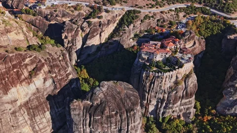 Aerial view of the unique rock formations and monastery in Greece Stock Footage 294786853