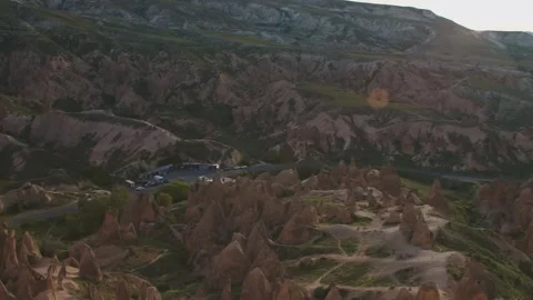 Aerial view of the unique rock formations in the Red Rose Valley, Cappadocia, Tu Stock Footage 332545733