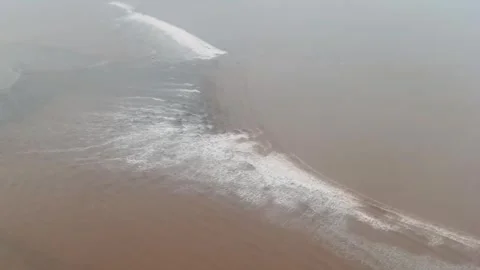 Aerial View of Unique Tidal Bore Waves on Qiantang River Stock Footage 329339579