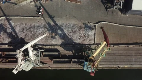 Aerial view. Unloading of cast iron from vogons in the seaport.  Stock Footage 196392004