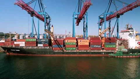 Aerial view of unloading containers at the port Stock Footage 154596468