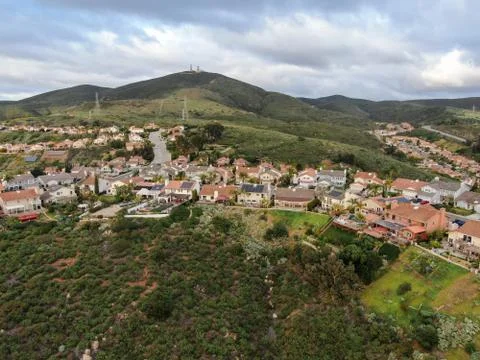Aerial view of upper middle class neighborhood in the valley during clouded day Stock Photos