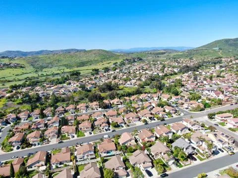 Aerial view of upper middle class neighborhood in the valley with blue sky Stock Photos