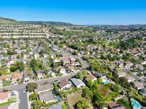 Aerial view of upper middle class neighborhood in the valley with blue sky Stock Photos