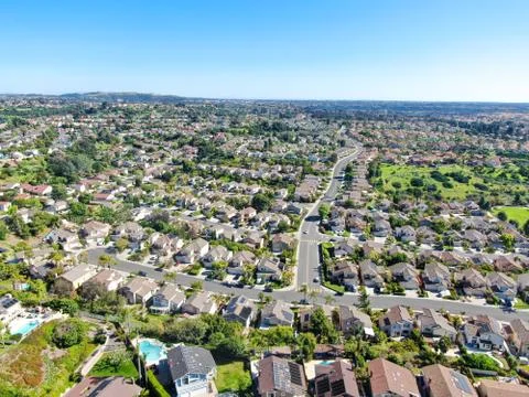 Aerial view of upper middle class neighborhood in the valley with blue sky Stock Photos