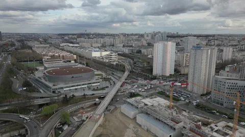 Aerial view of urban development and sports arena at Porte de la Chapelle Stock Footage 303787255