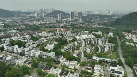 Aerial View of Urban Development and Green Spaces in Modern City Stock Footage 311575621