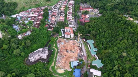 Aerial View of Urban Development and Green Forests with Construction Site Stock Footage 344814142